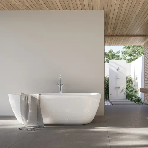 Freestanding tub with garden view in a contemporary bathroom