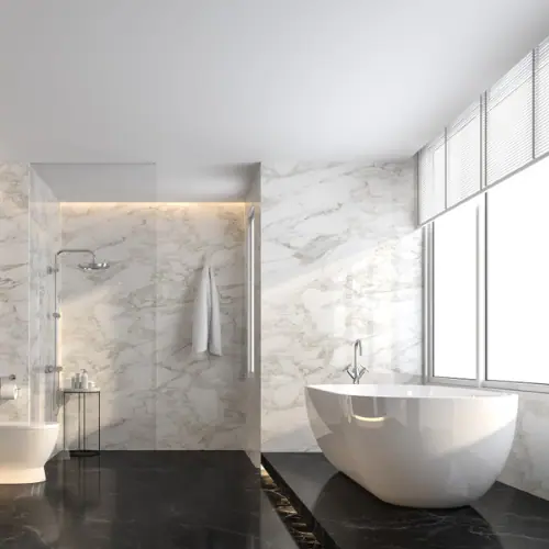 Marble walk-in shower with LED niche lighting and freestanding tub